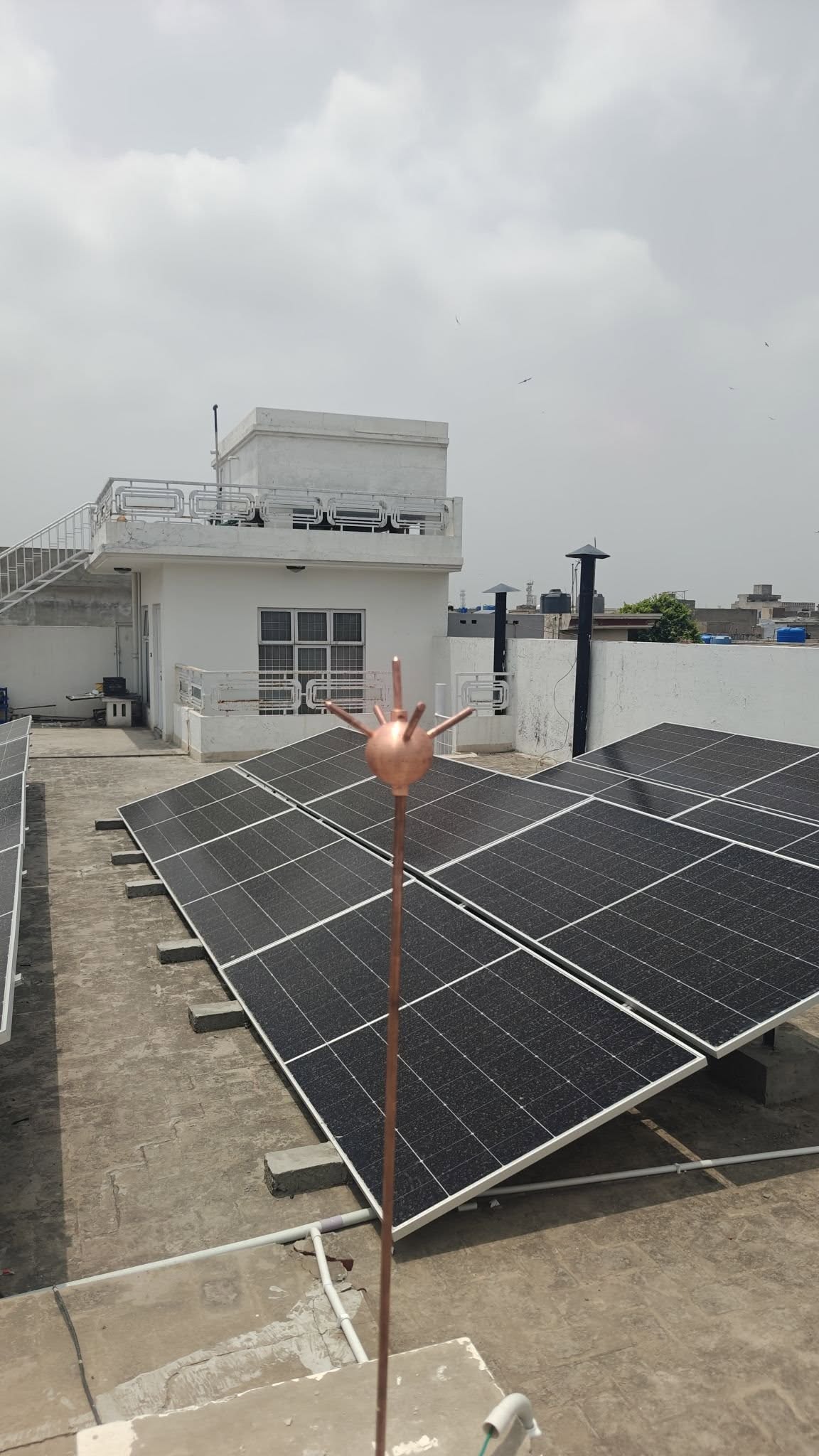 Rooftop solar panel array installed by SunMax Energy Solutions on a commercial building